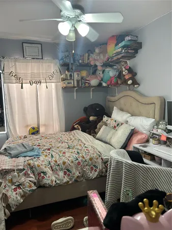 a bedroom with a bed and a table