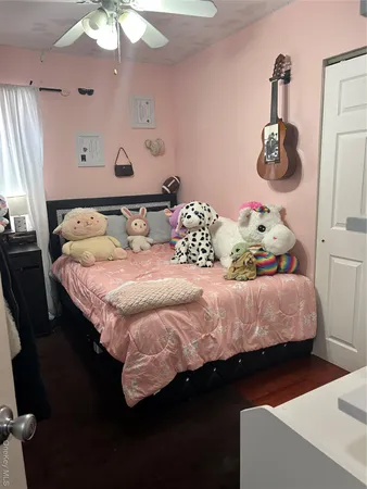 a bed sitting in a bedroom and furniture