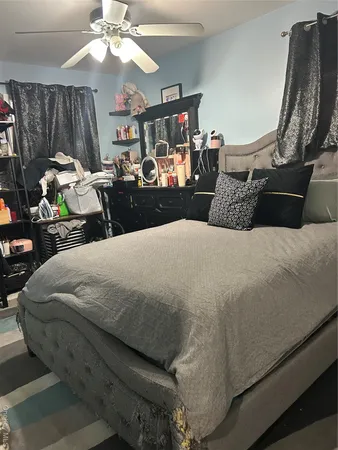 a bathroom with a toilet and a mirror