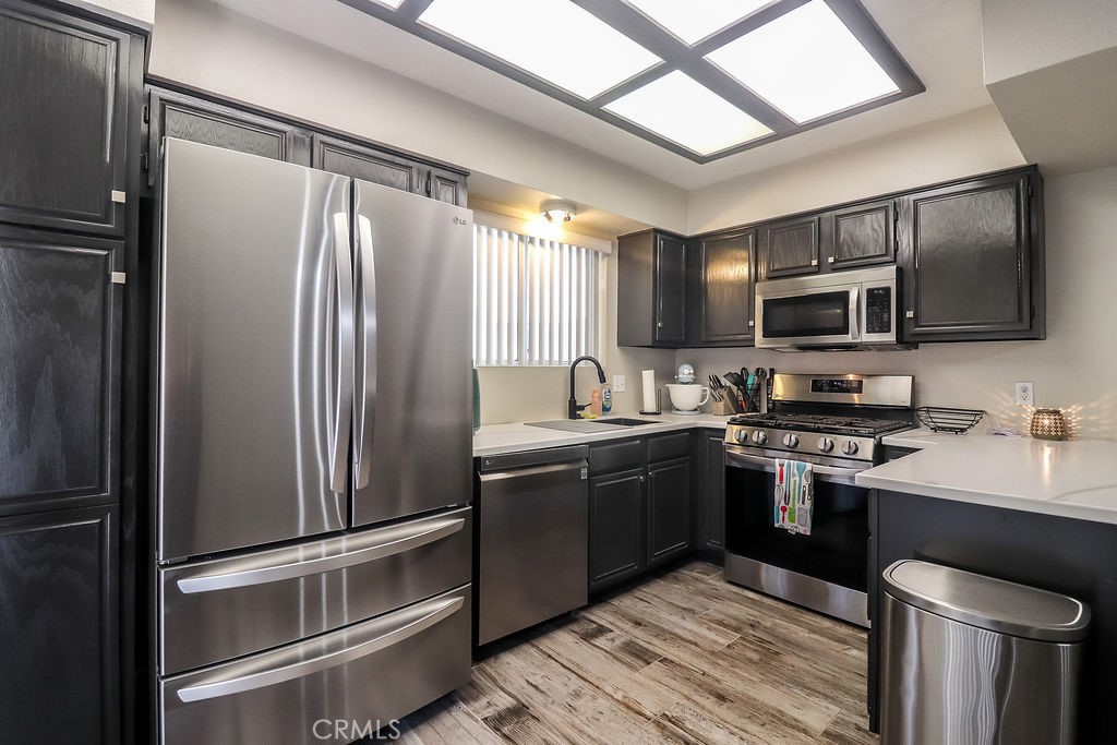 1330 Santa Fe Circle Needles, CA 92363 - Photo 12 of 28 a kitchen with stainless steel appliances granite countertop a refrigerator stove and sink