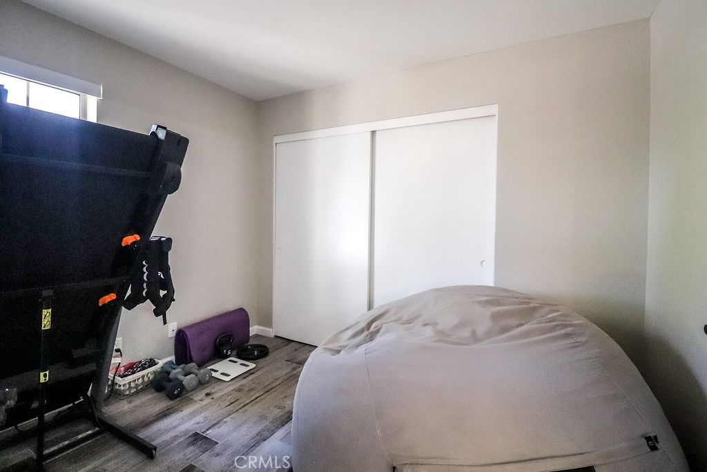 1330 Santa Fe Circle Needles, CA 92363 - Photo 14 of 28 a bedroom with a bed and a flat screen tv