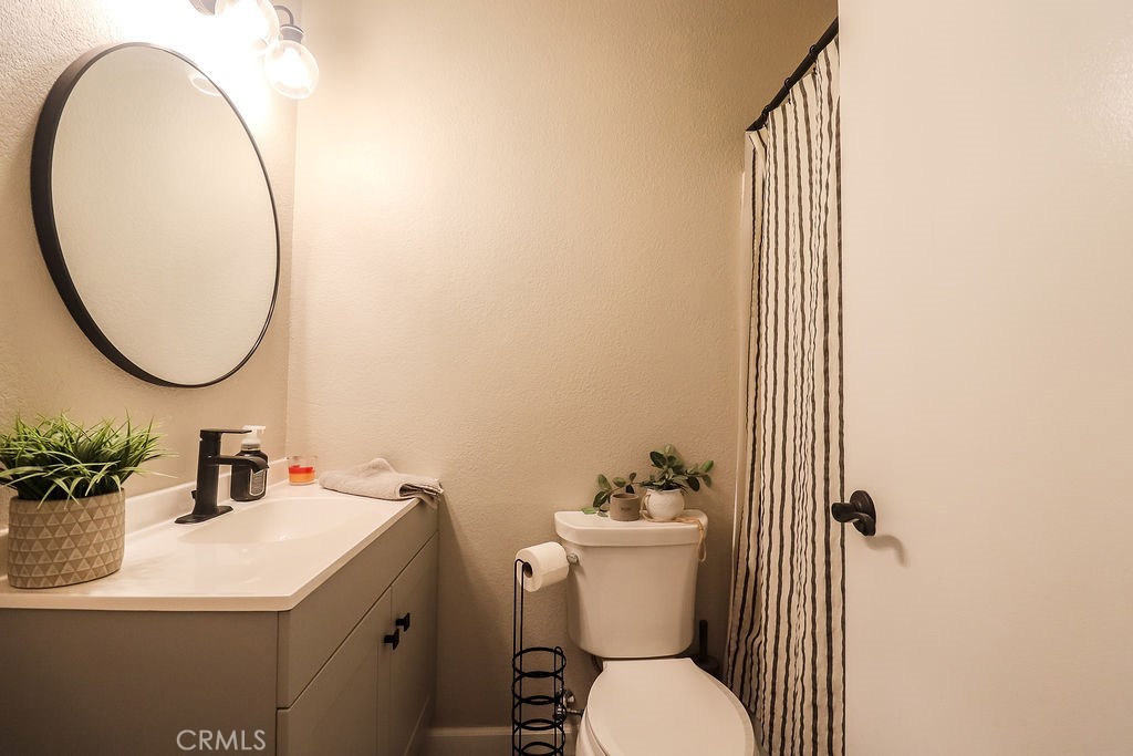 1330 Santa Fe Circle Needles, CA 92363 - Photo 20 of 28 a bathroom with a sink and a mirror