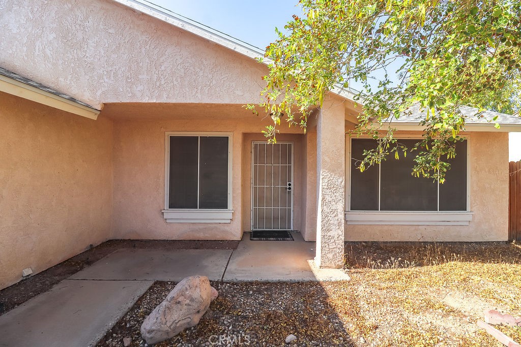 1330 Santa Fe Circle Needles, CA 92363 - Photo 2 of 28 a front view of a house with a yard