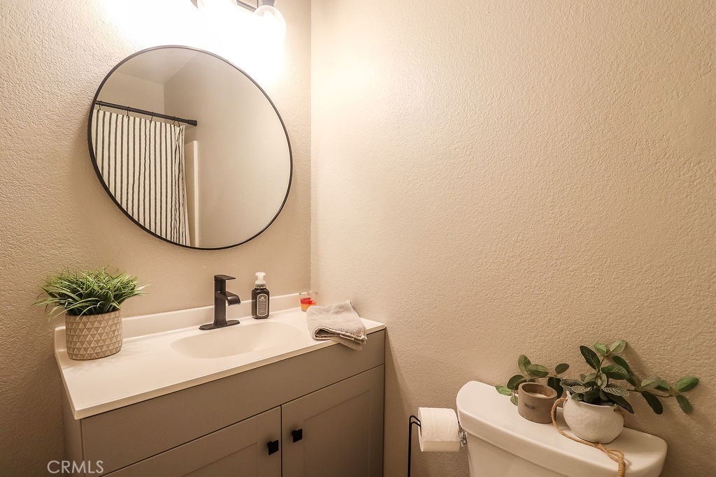 1330 Santa Fe Circle Needles, CA 92363 - Photo 21 of 28 a bathroom with a sink and a mirror
