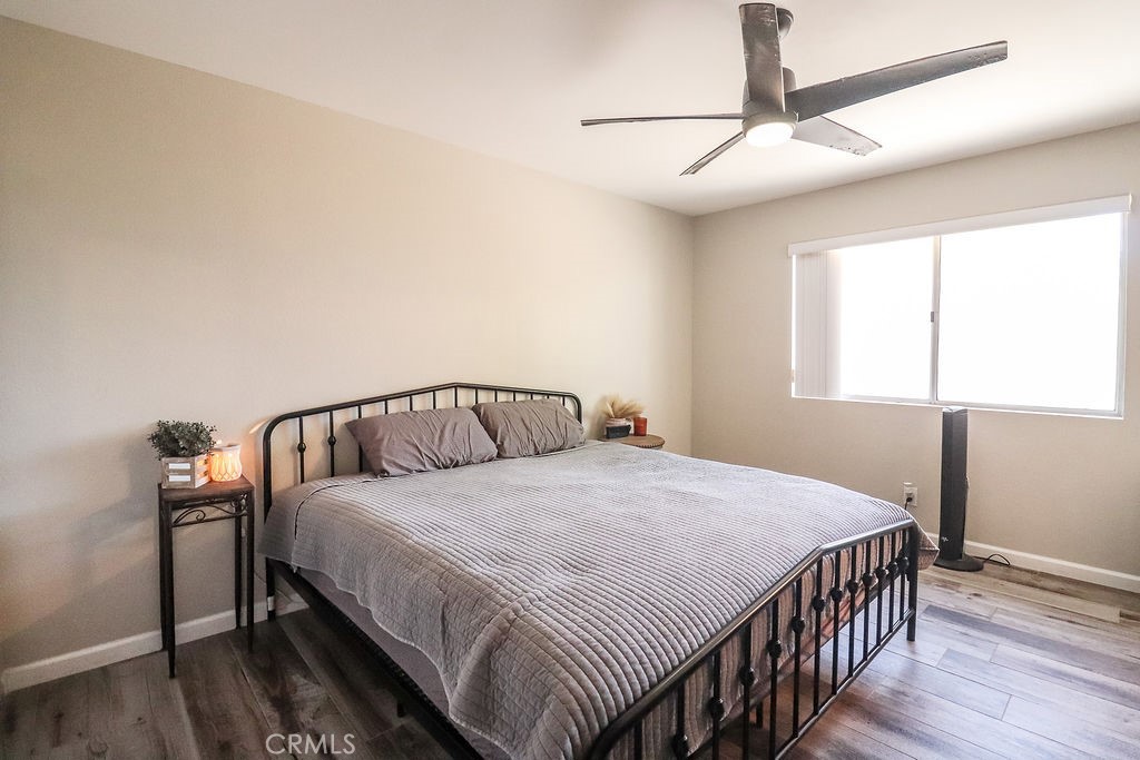 1330 Santa Fe Circle Needles, CA 92363 - Photo 22 of 28 a bedroom with a bed and a chandelier