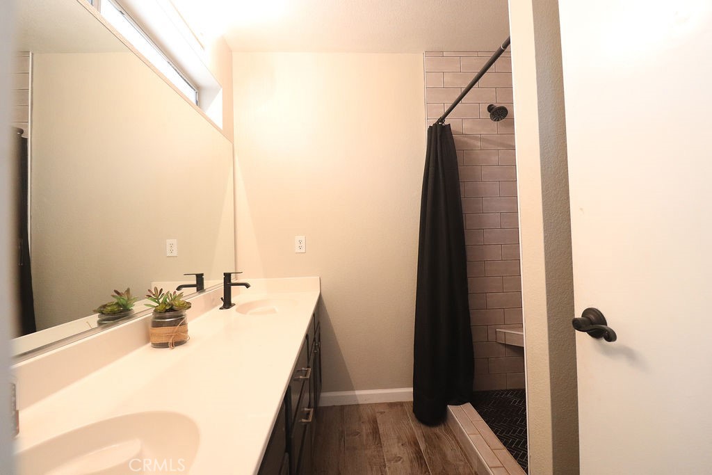 1330 Santa Fe Circle Needles, CA 92363 - Photo 25 of 28 a bathroom with a sink and mirror