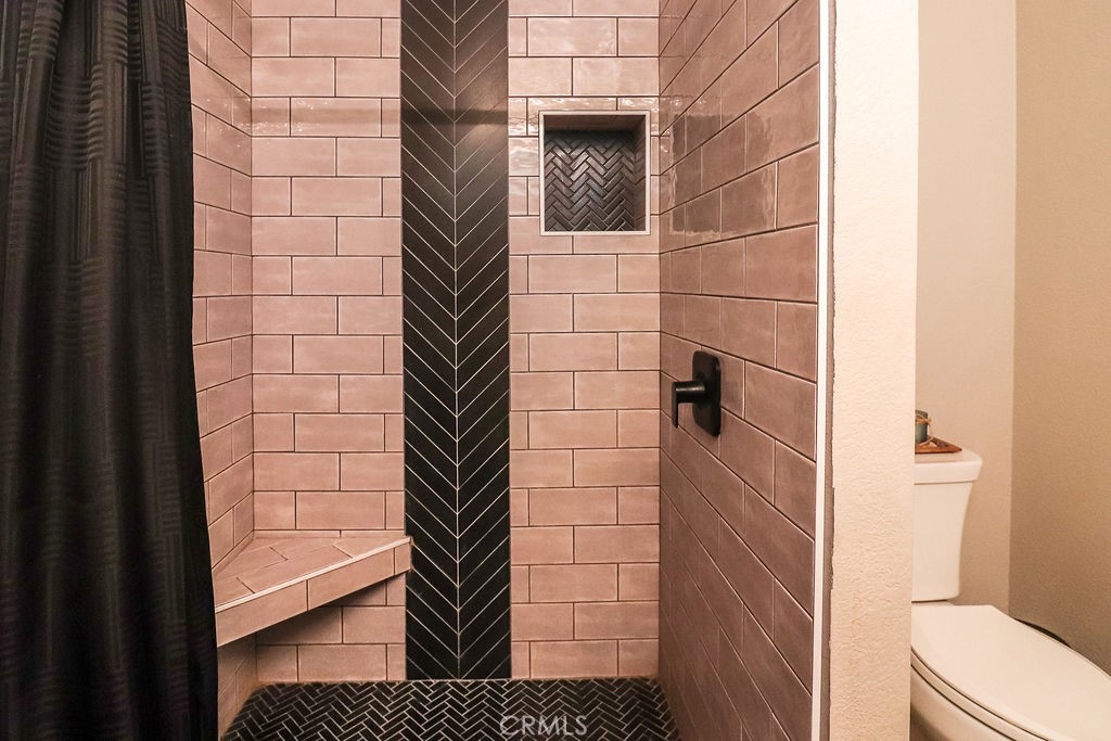 1330 Santa Fe Circle Needles, CA 92363 - Photo 27 of 28 a bathroom with a shower and a toilet