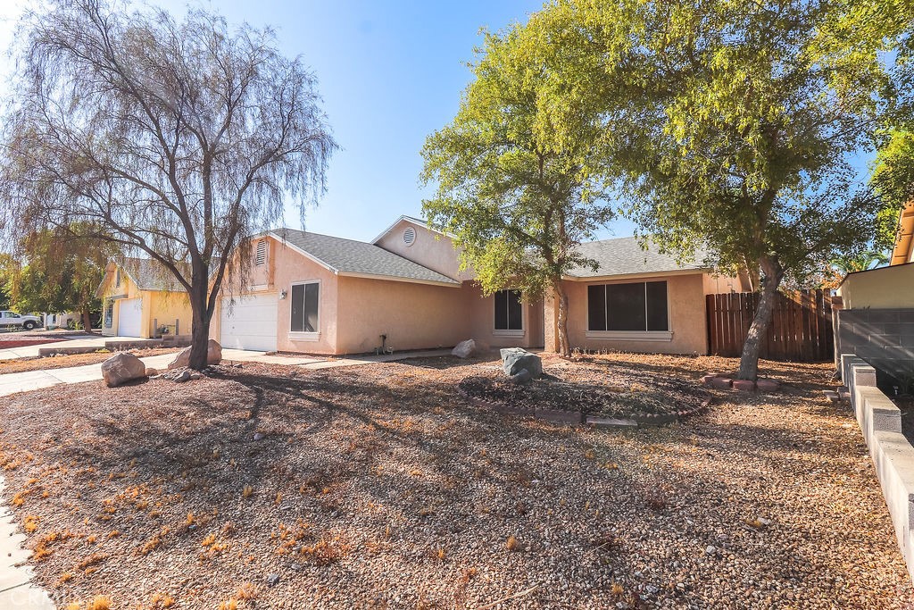 1330 Santa Fe Circle Needles, CA 92363 - Photo 28 of 28 a view of a house with a yard and large tree