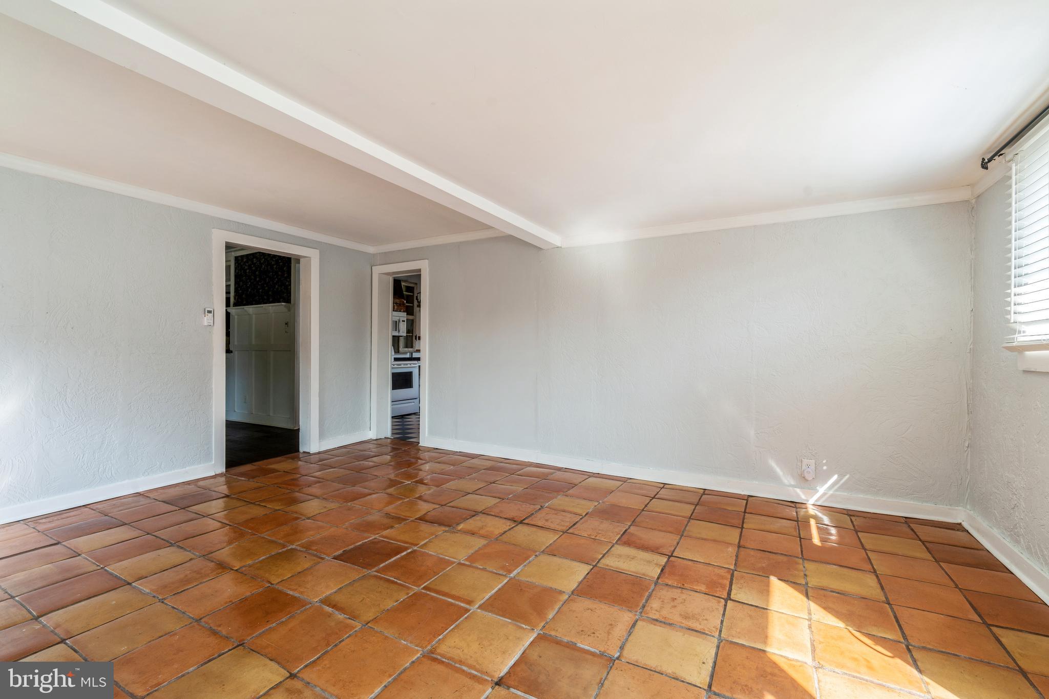 212 Maple Avenue Ridgely, MD 21660 - Photo 12 of 41 Terra Cotta Tile Livingroom with Pellet Stove
