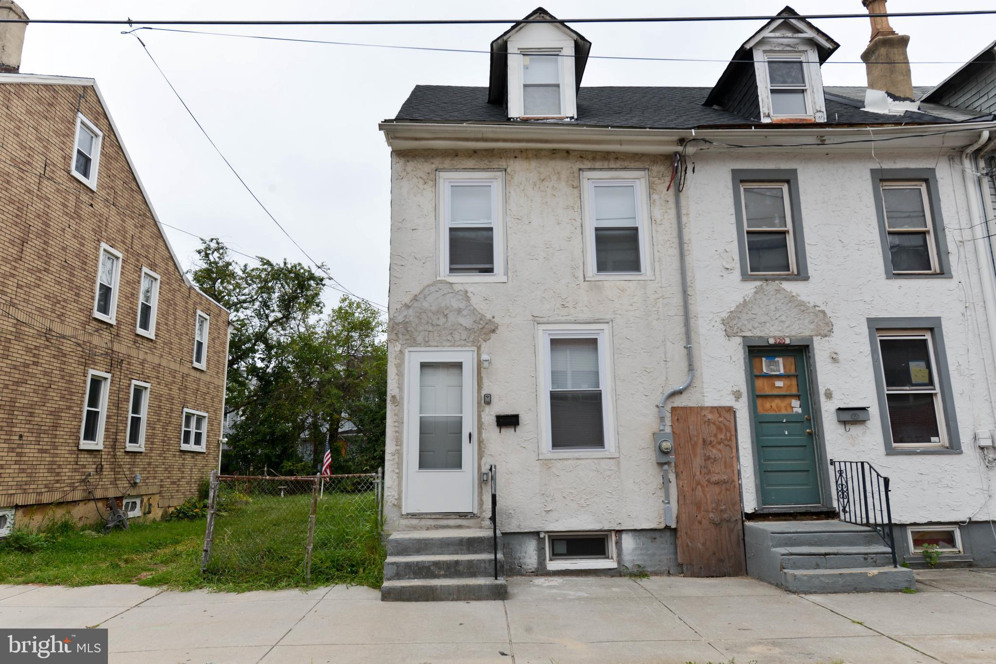 322 Ridgeway Street Gloucester City, NJ 08030 - Photo 1 of 22 a view of a white house with large windows