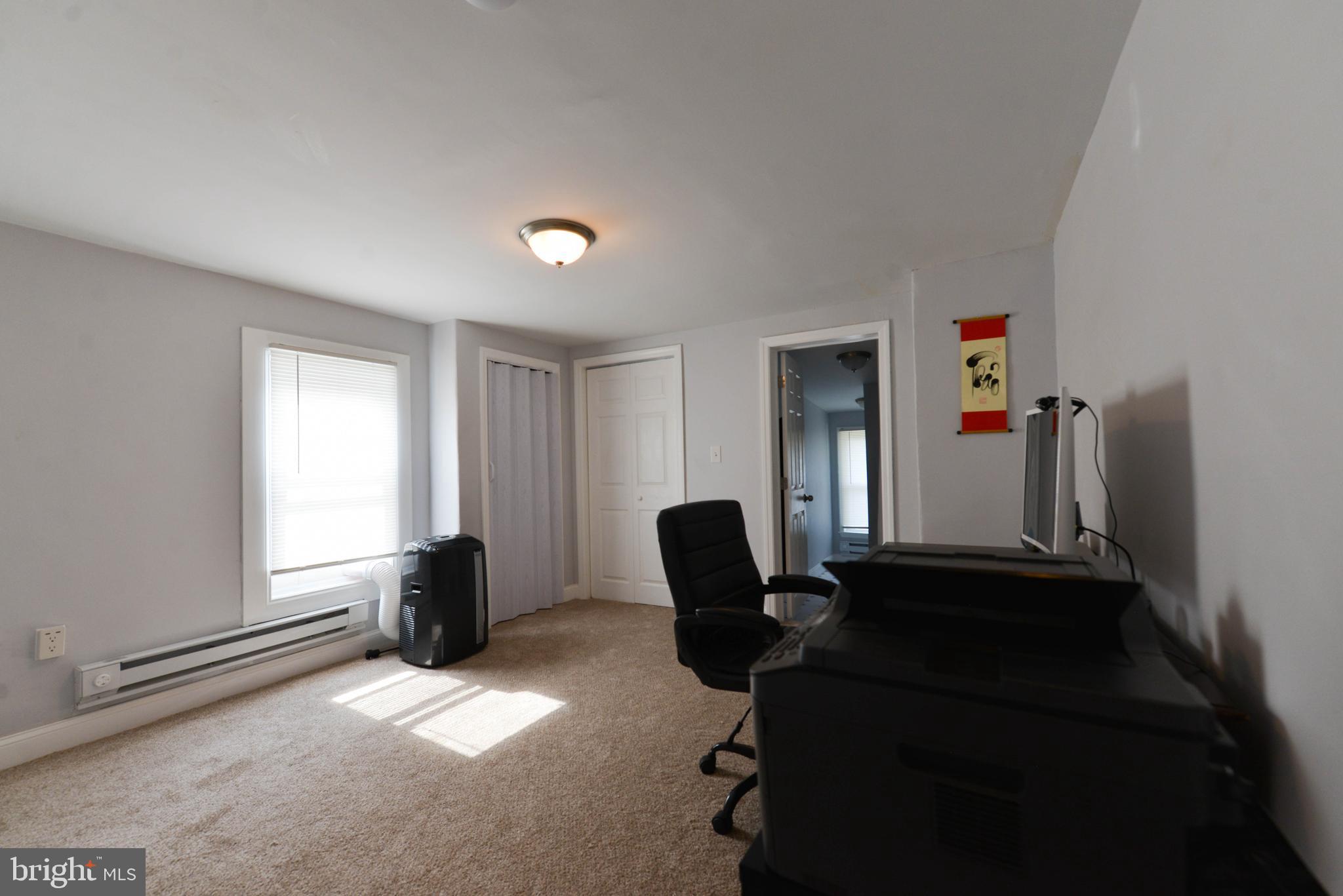 322 Ridgeway Street Gloucester City, NJ 08030 - Photo 14 of 22 a living room with furniture and a window