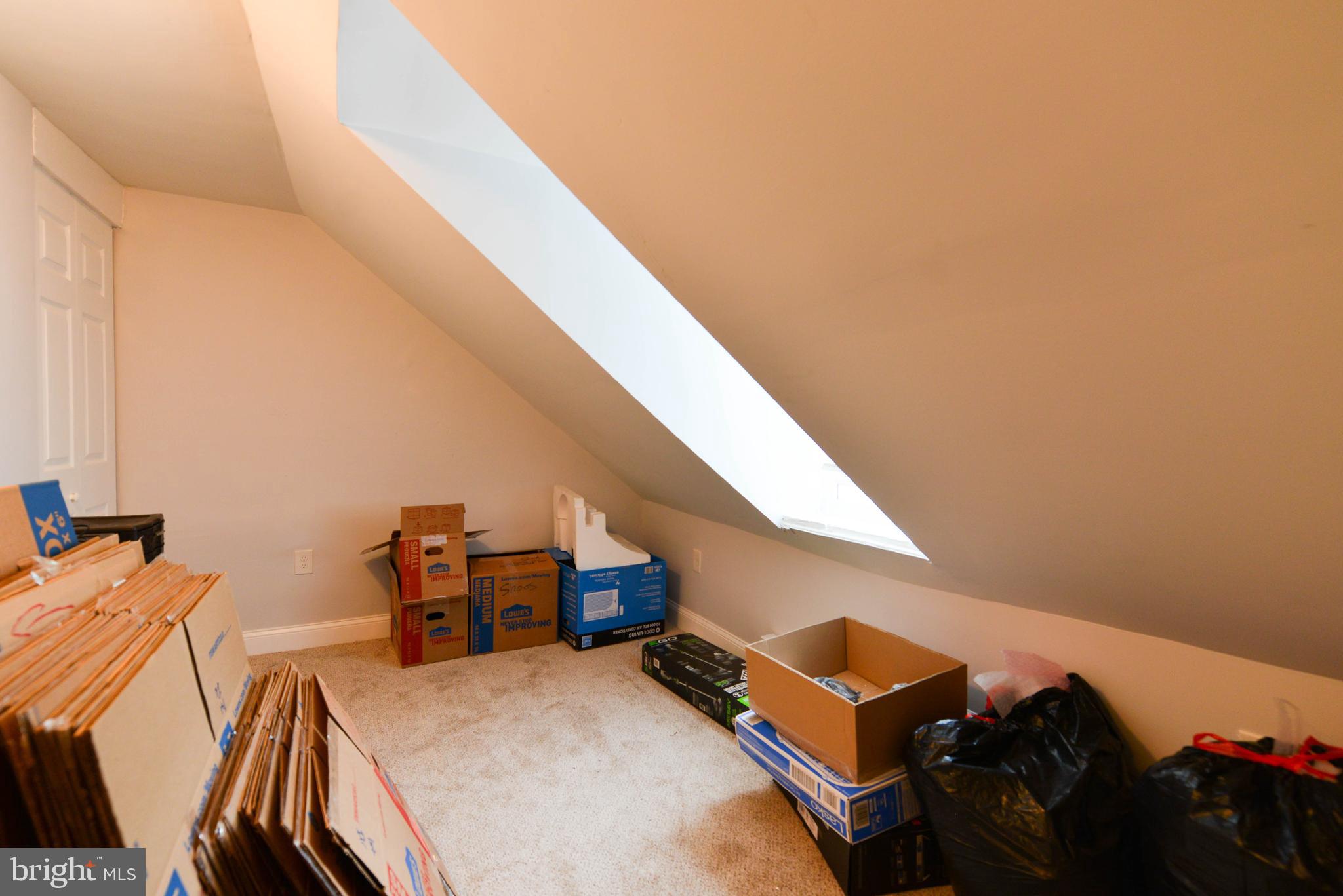 322 Ridgeway Street Gloucester City, NJ 08030 - Photo 16 of 22 a bed room with a bed and a chandelier