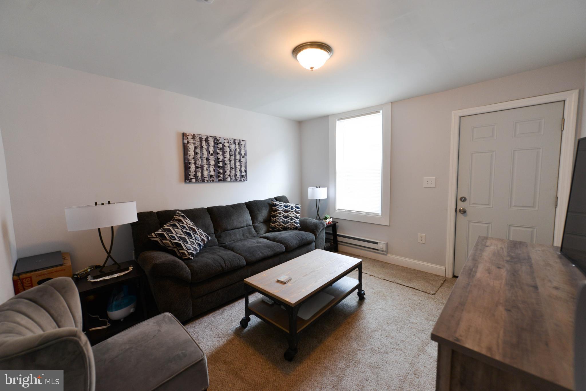 322 Ridgeway Street Gloucester City, NJ 08030 - Photo 4 of 22 a living room with furniture and a window