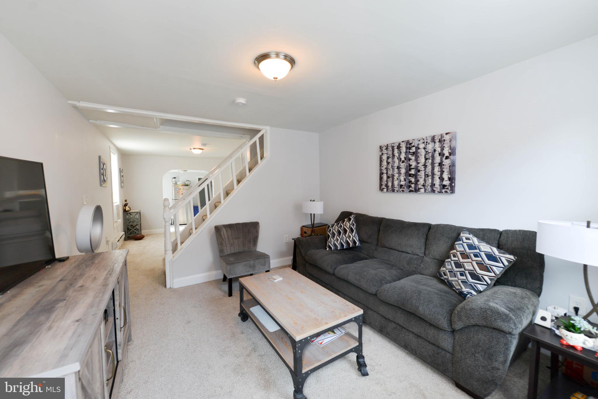 322 Ridgeway Street Gloucester City, NJ 08030 - Photo 6 of 22 a living room with furniture and wooden floor