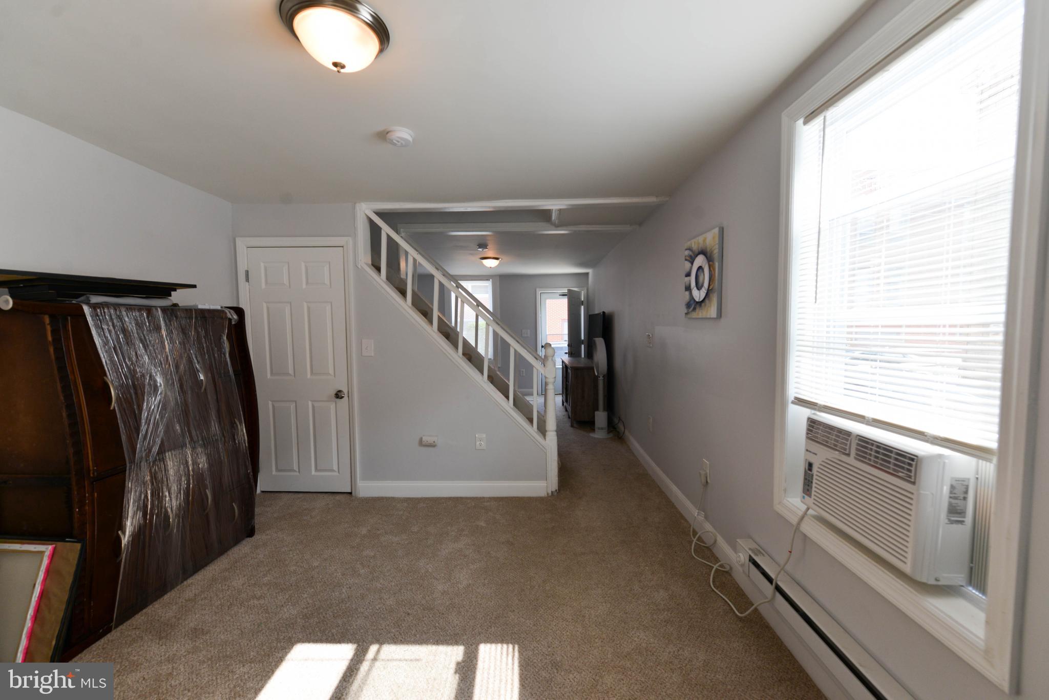 322 Ridgeway Street Gloucester City, NJ 08030 - Photo 7 of 22 a view of a hallway with stairs