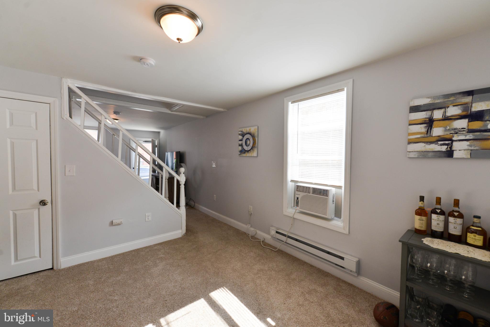 322 Ridgeway Street Gloucester City, NJ 08030 - Photo 8 of 22 a view of livingroom with furniture and windows