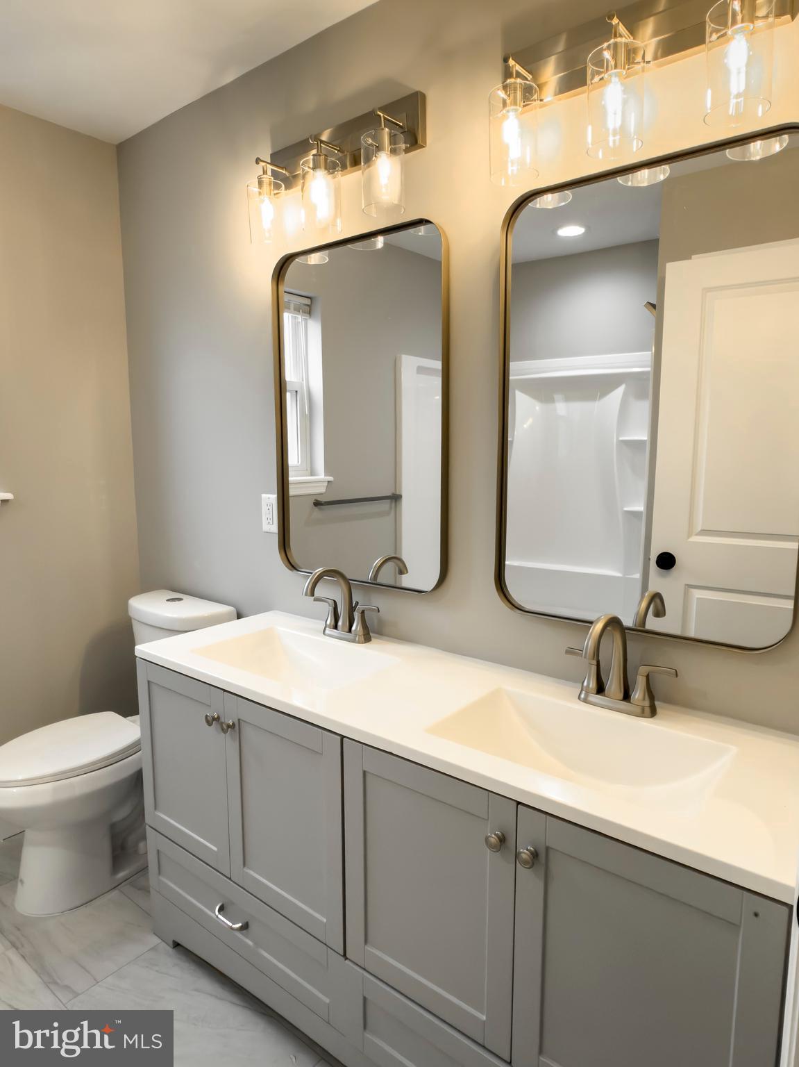 702 Delaware Avenue Riverside, NJ 08075 - Photo 11 of 15 a bathroom with 2 sink and a toilet