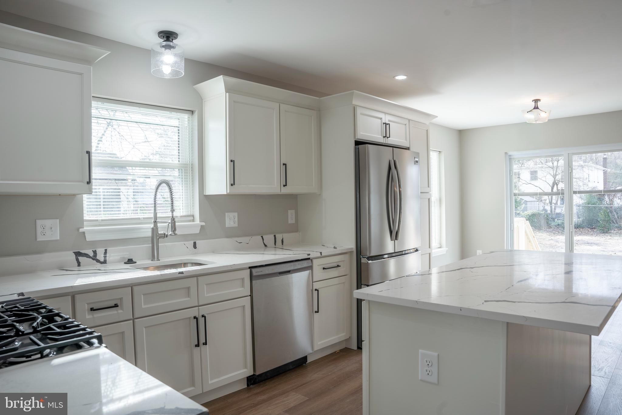 702 Delaware Avenue Riverside, NJ 08075 - Photo 4 of 15 a kitchen with a sink stove and refrigerator