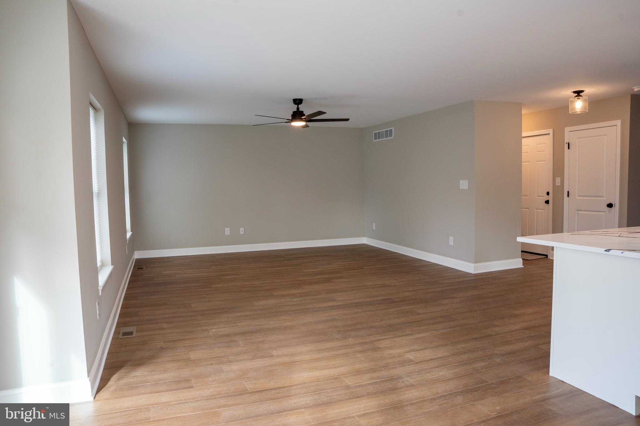 702 Delaware Avenue Riverside, NJ 08075 - Photo 6 of 15 wooden floor in an empty room with a window