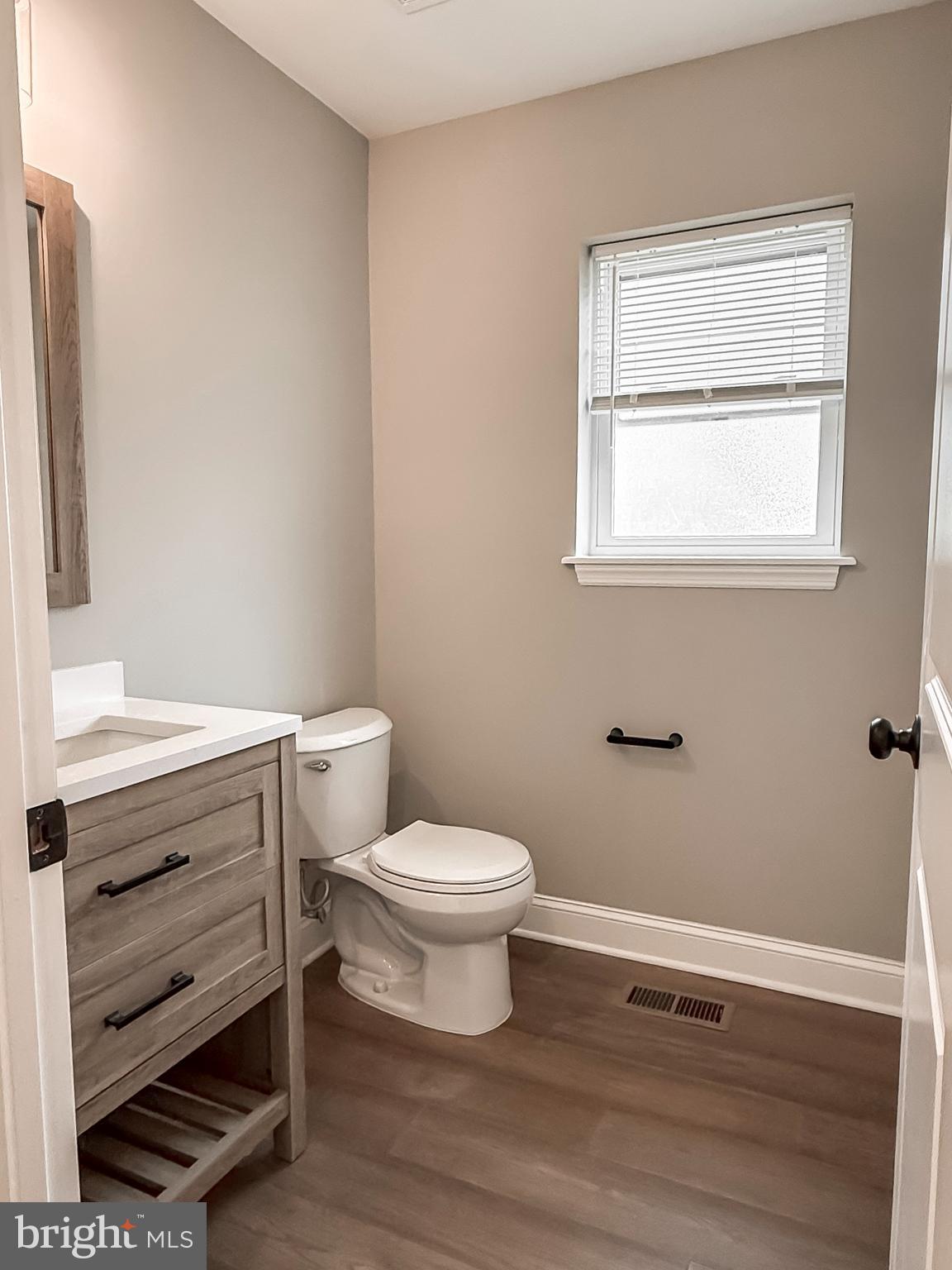 702 Delaware Avenue Riverside, NJ 08075 - Photo 7 of 15 a bathroom with a toilet and a sink