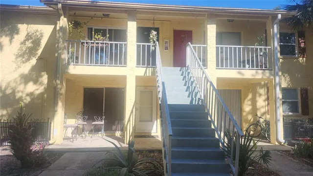 a view of entryway and hall with a front door