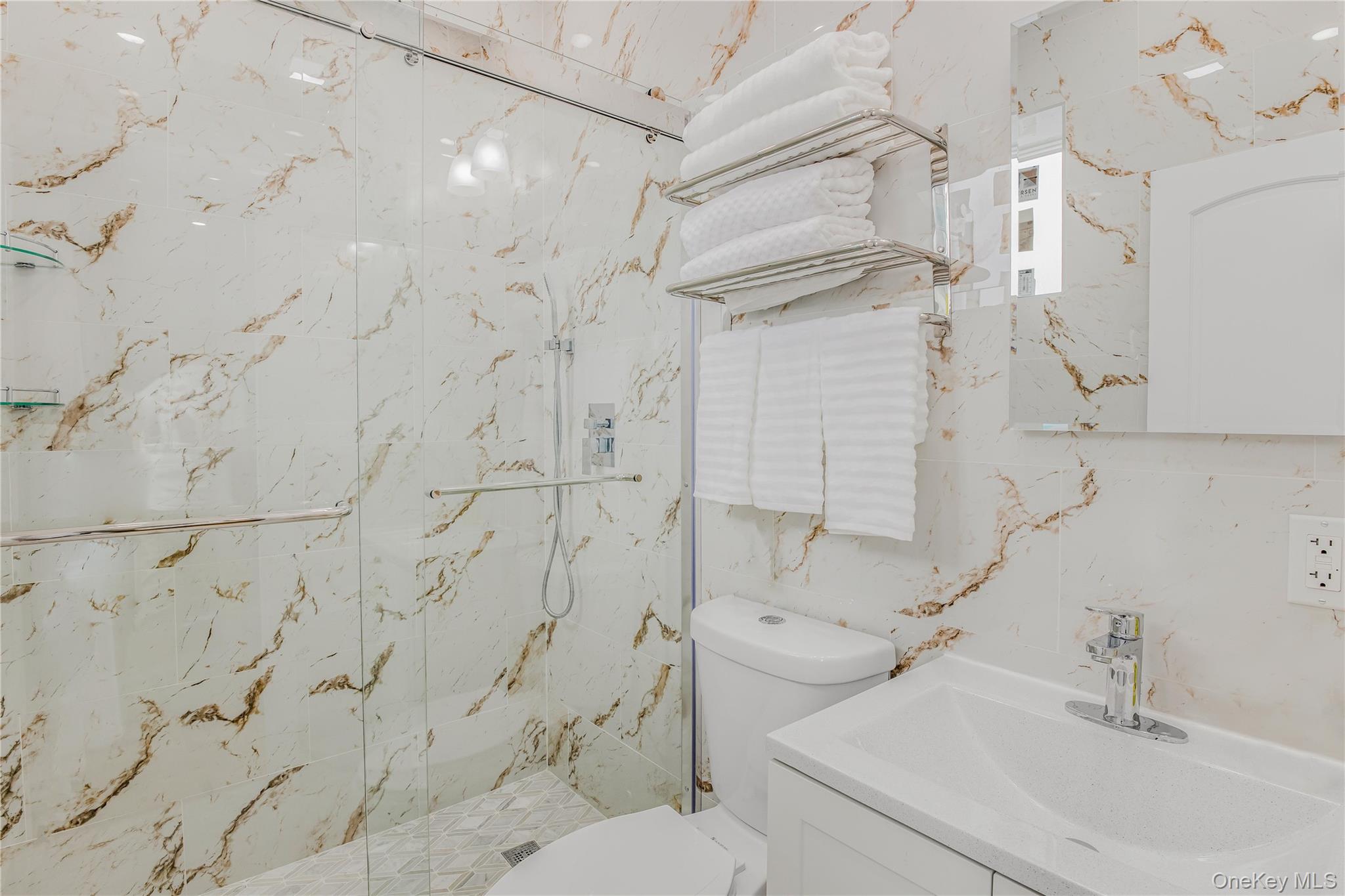 43-47 44th Street, Unit 3F Queens, NY 11104 - Photo 8 of 17 a bathroom with a sink toilet and shower