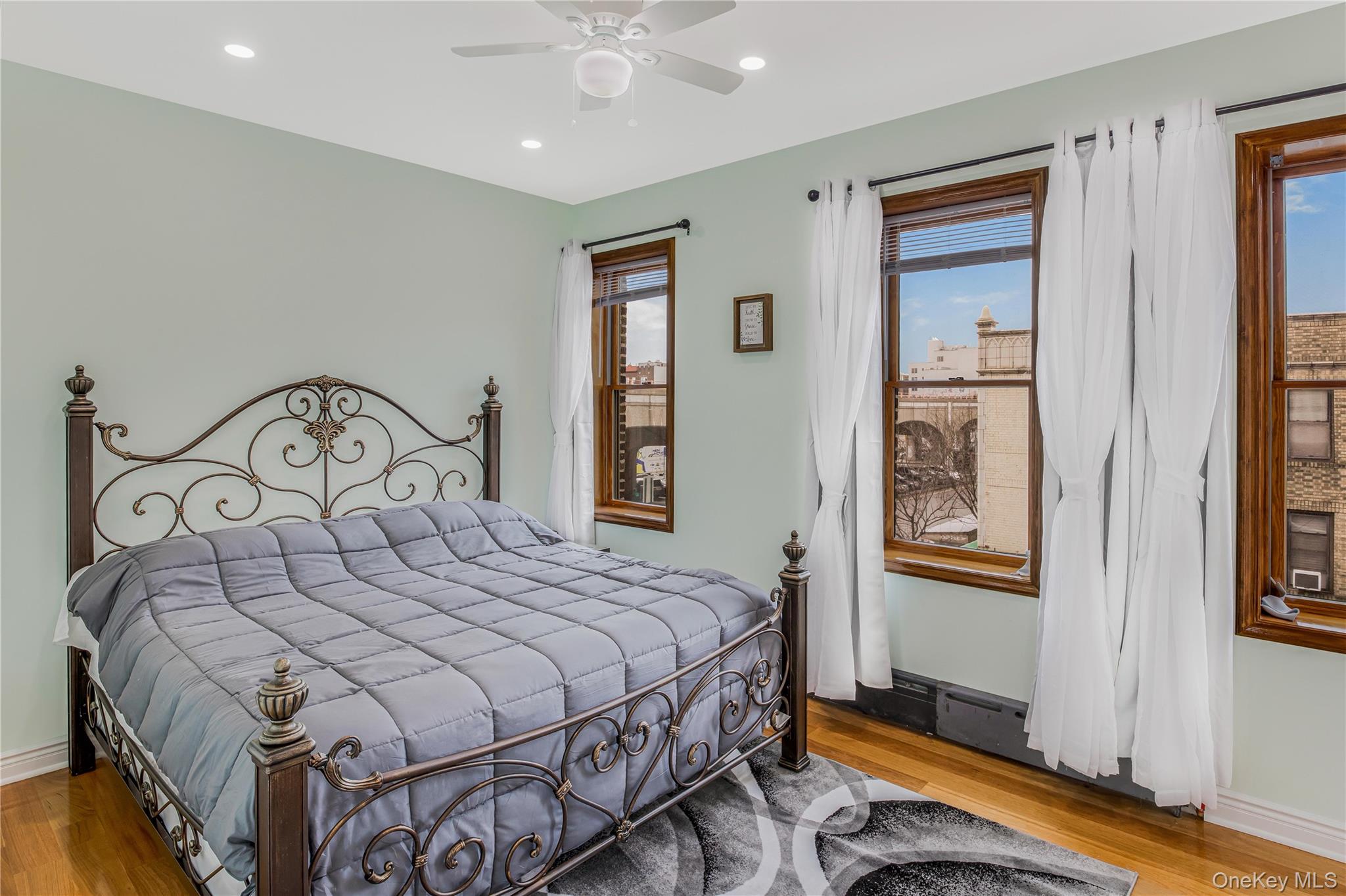 43-47 44th Street, Unit 3F Queens, NY 11104 - Photo 9 of 17 a bedroom with a bed and a window