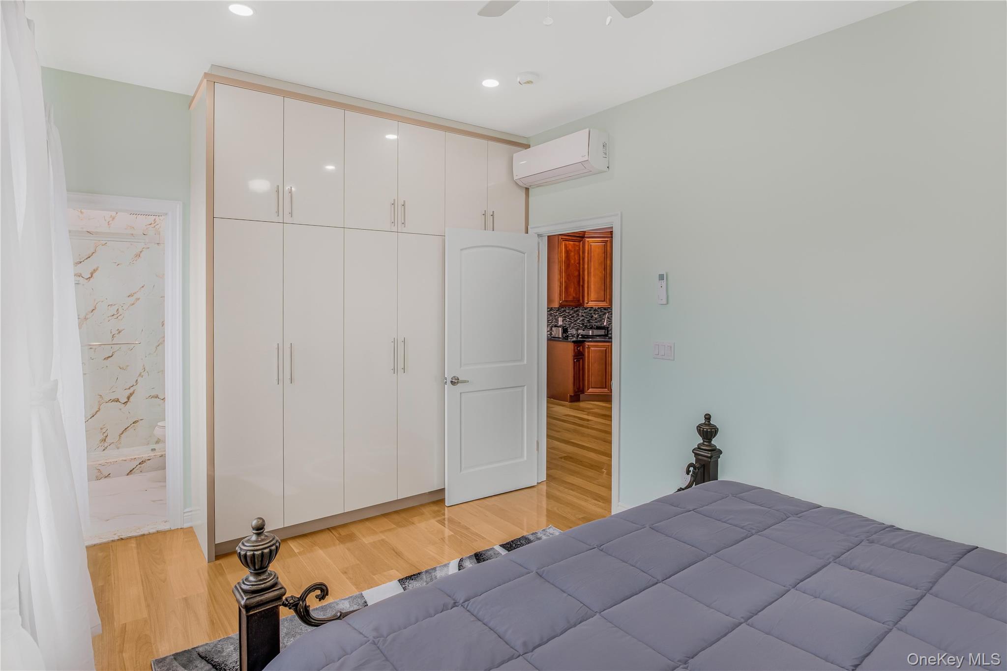 43-47 44th Street, Unit 3F Queens, NY 11104 - Photo 10 of 17 a bedroom with a bed and a table in it