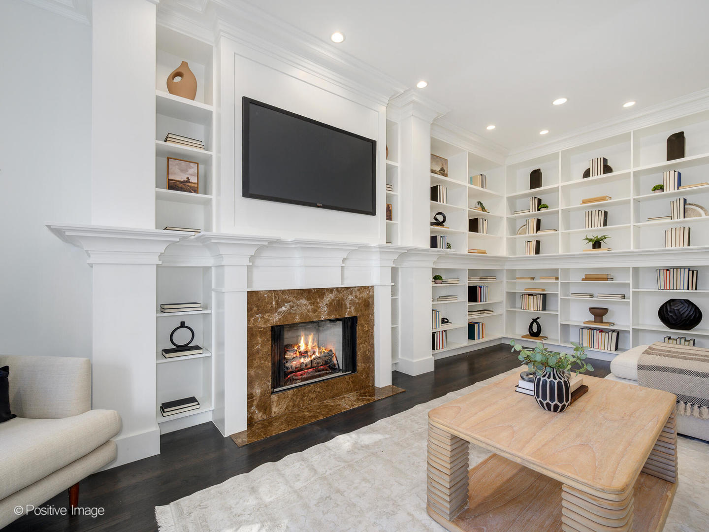 37 East Elm Street Chicago, IL 60611 - Photo 13 of 32 a living room with furniture a flat screen tv and a fireplace