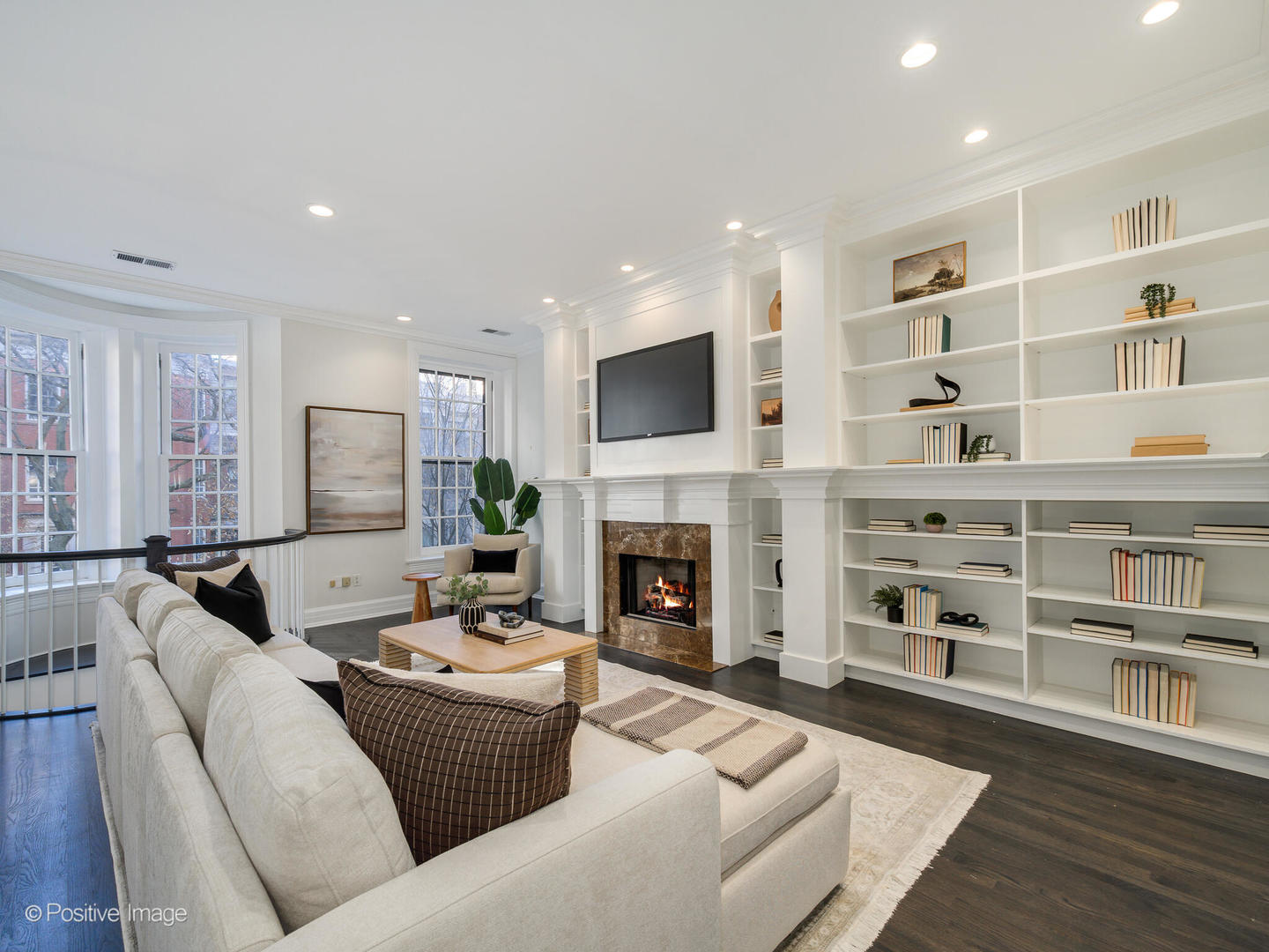 37 East Elm Street Chicago, IL 60611 - Photo 15 of 32 a living room with furniture fireplace and a flat screen tv