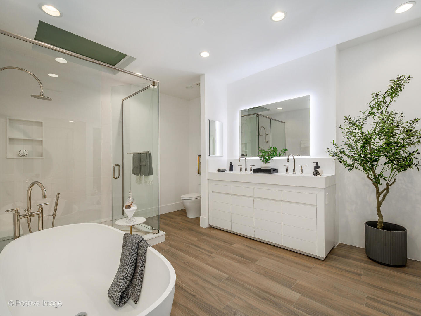 37 East Elm Street Chicago, IL 60611 - Photo 19 of 32 a bathroom with a double vanity sink a mirror and a shower