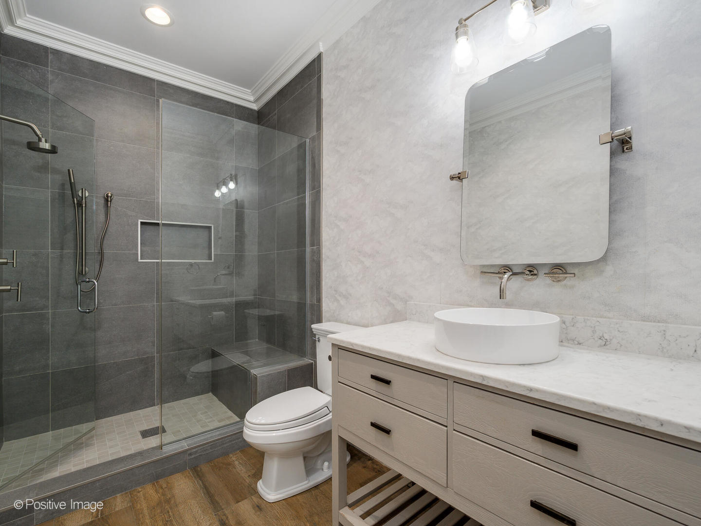 37 East Elm Street Chicago, IL 60611 - Photo 23 of 32 a bathroom with a sink a toilet and shower