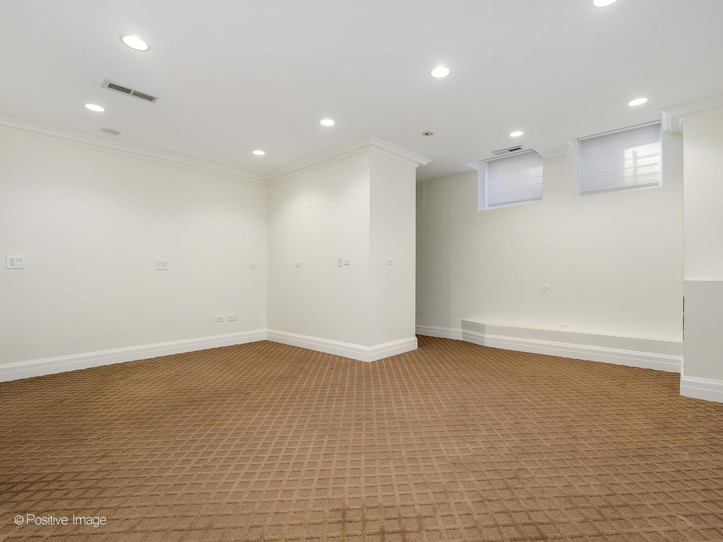 37 East Elm Street Chicago, IL 60611 - Photo 31 of 32 a view of an empty room with wooden floor and a window