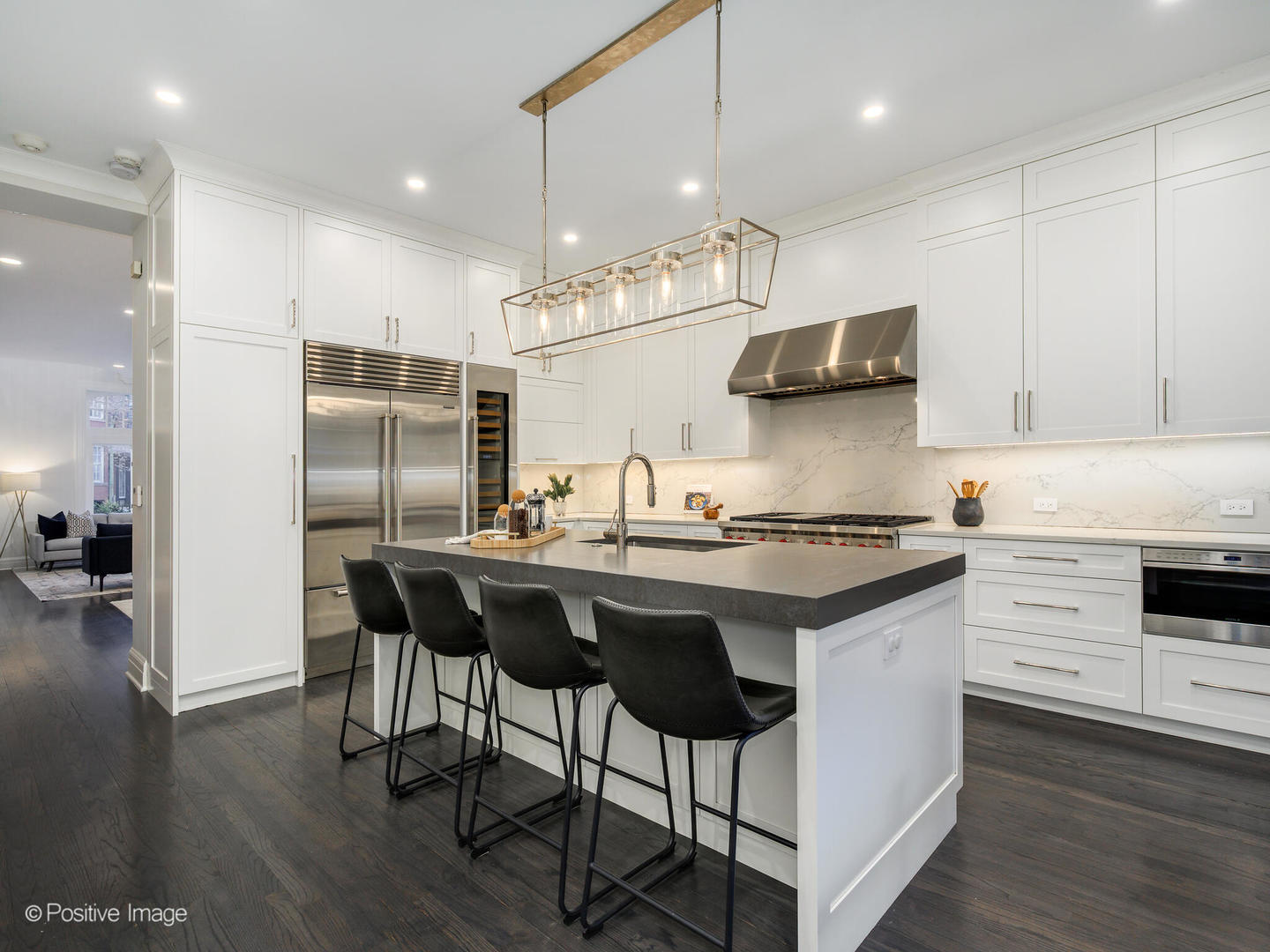 37 East Elm Street Chicago, IL 60611 - Photo 8 of 32 a kitchen with stainless steel appliances granite countertop a sink stove and refrigerator