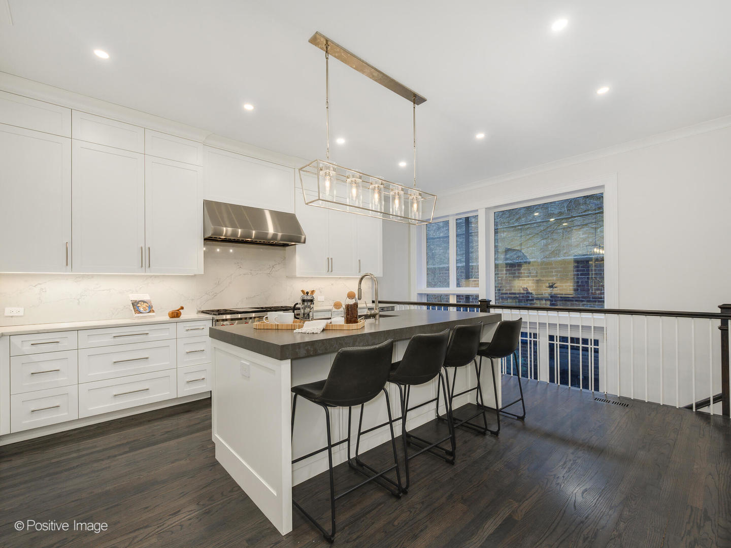 37 East Elm Street Chicago, IL 60611 - Photo 9 of 32 a kitchen with stainless steel appliances granite countertop a stove a sink dishwasher and a refrigerator with wooden floor