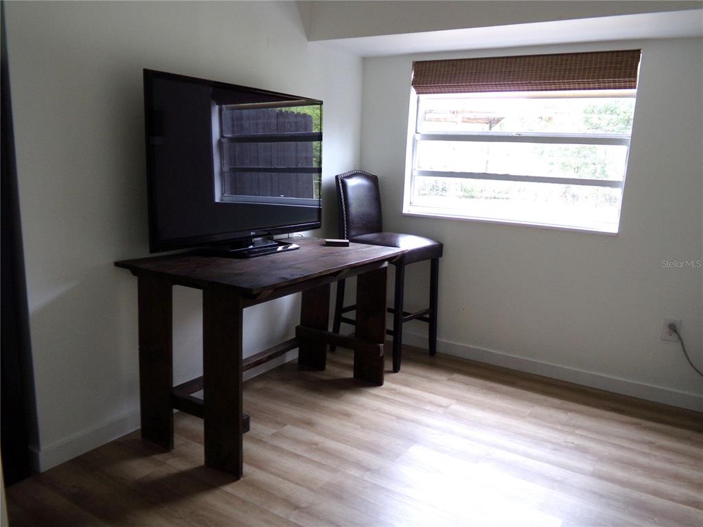 33068 Round Table Road Dade City, FL 33523 - Photo 27 of 82 a view of a workspace with furniture and window