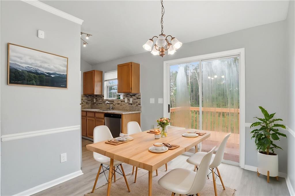 5855 Crescent Ridge Court Lithonia, GA 30058 - Photo 6 of 46 a view of a dining room with furniture window and outside view