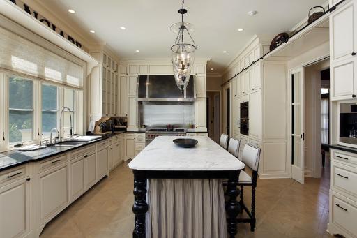 175 Sheridan Road Winnetka, IL 60093 - Photo 9 of 16 a kitchen with a sink stove and refrigerator