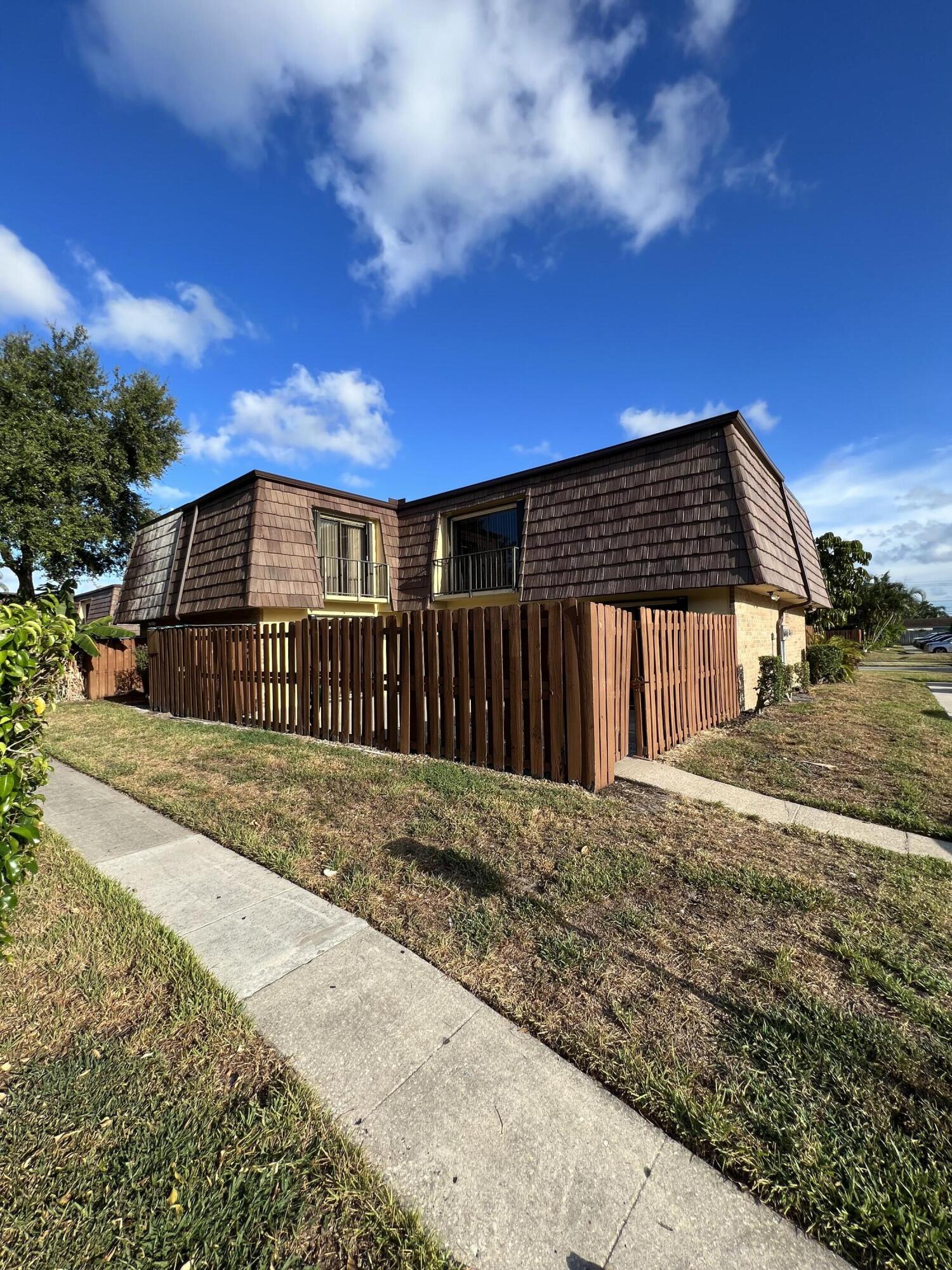 731 Springdale Circle Palm Springs, FL 33461 - Photo 1 of 20 a view of a house with a roof deck