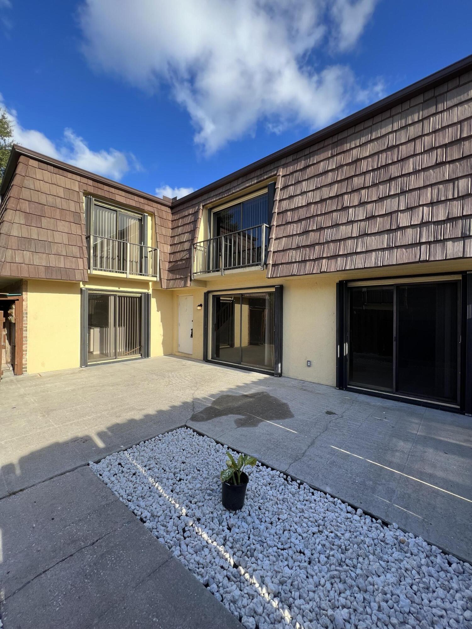 731 Springdale Circle Palm Springs, FL 33461 - Photo 3 of 20 a front view of a house