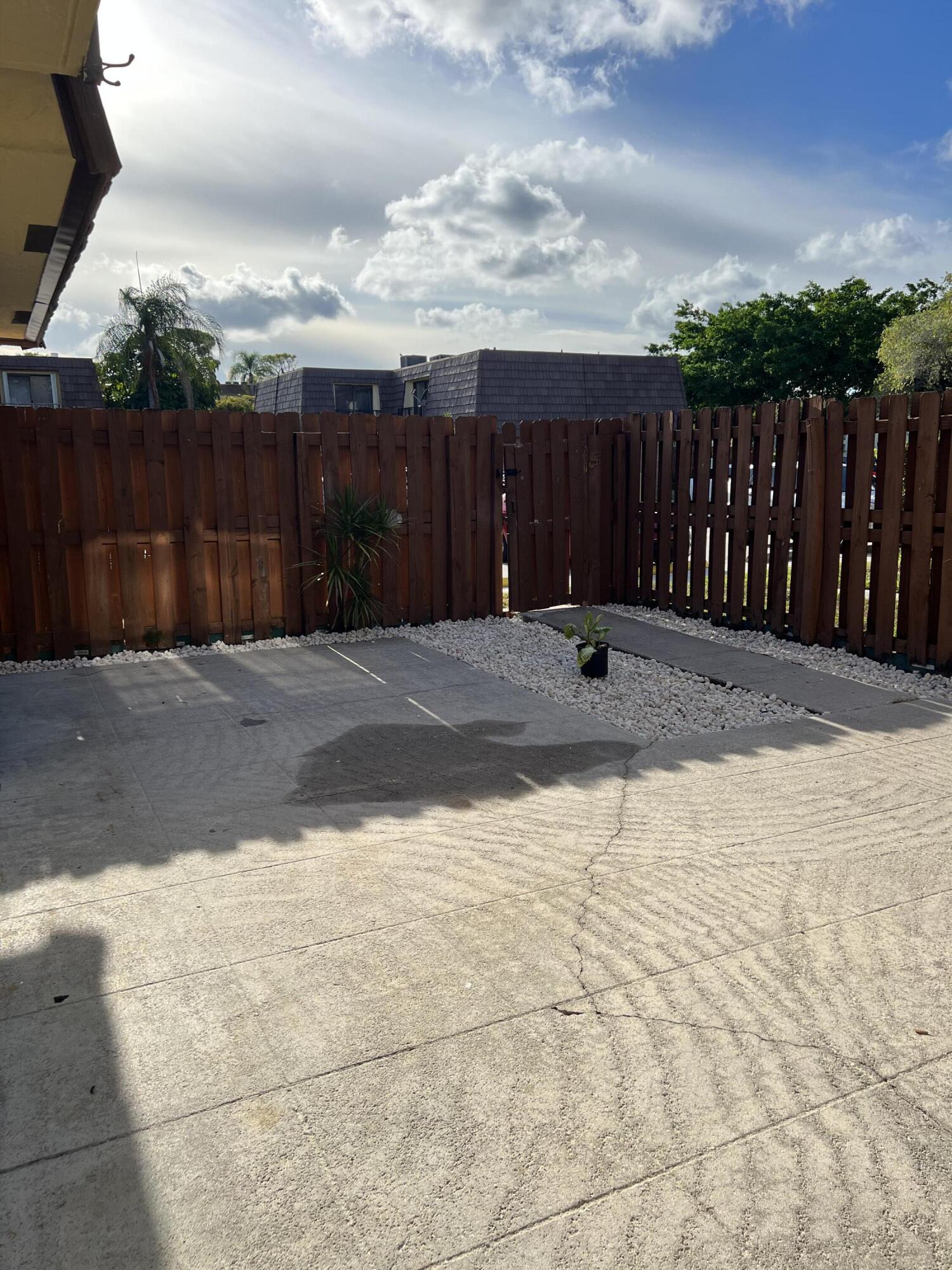 731 Springdale Circle Palm Springs, FL 33461 - Photo 7 of 20 a backyard of a house