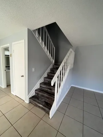 a view of an empty room and fire place