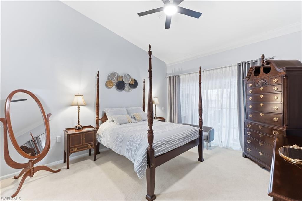 6840 Beach Resort Drive, Unit 16 Naples, FL 34114 - Photo 20 of 49 Bedroom with lofted ceiling, light colored carpet, and ceiling fan