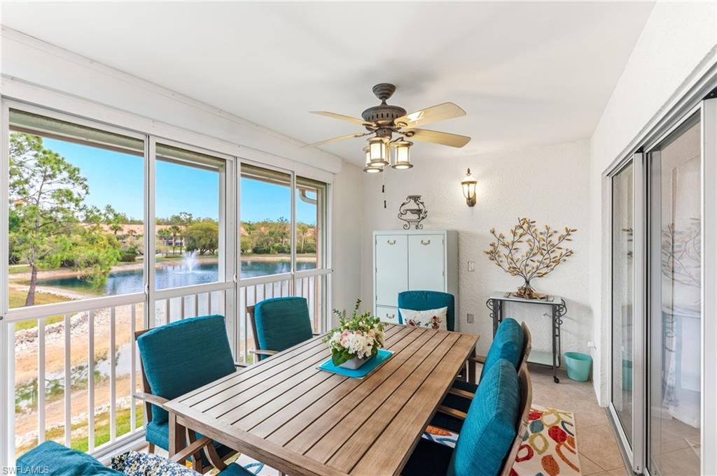 6840 Beach Resort Drive, Unit 16 Naples, FL 34114 - Photo 36 of 49 Dining space with ceiling fan, a water view, and light tile patterned floors