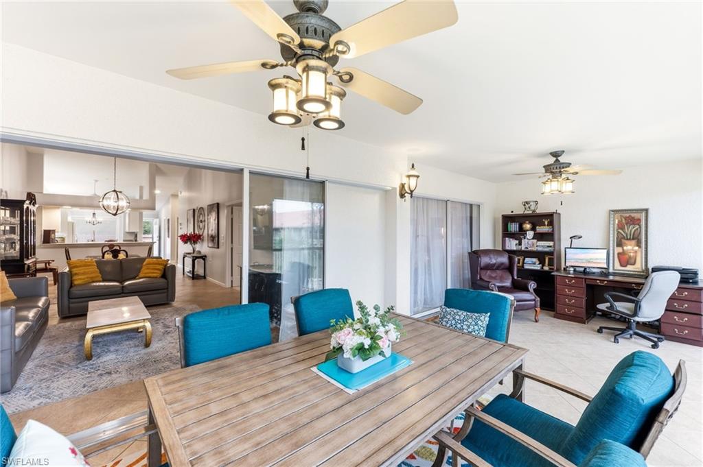6840 Beach Resort Drive, Unit 16 Naples, FL 34114 - Photo 38 of 49 Tiled dining room featuring suspended lighting, an office area, and ceiling fan