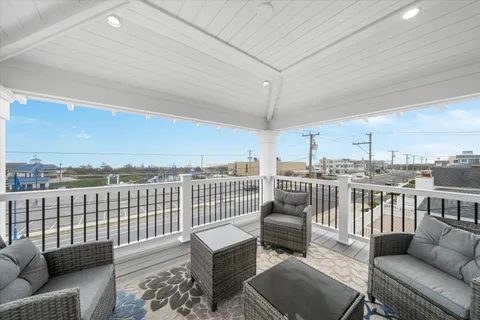 an outdoor living room with furniture