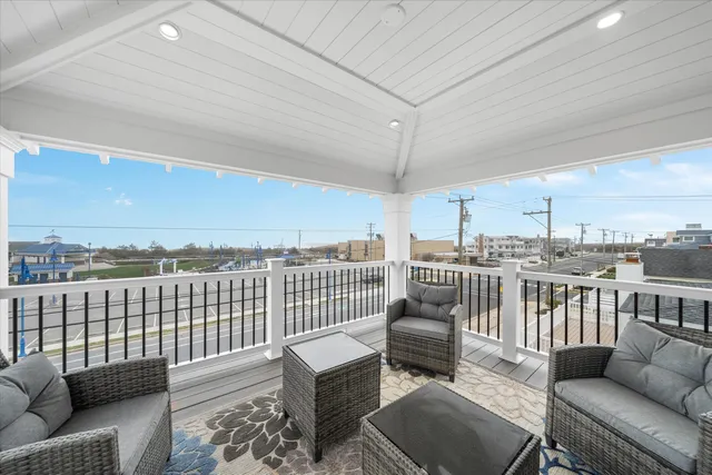 an outdoor living room with furniture