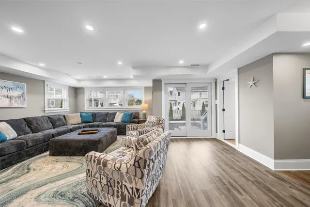 a living room with furniture window and wooden floor