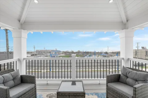 a view of a balcony with furniture