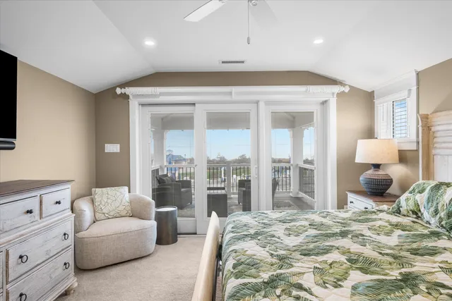 a bedroom with a large bed and a couch